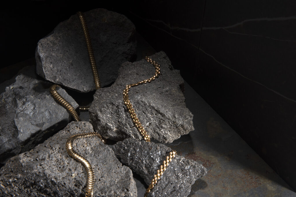 abstract gold chain jewellery presentation